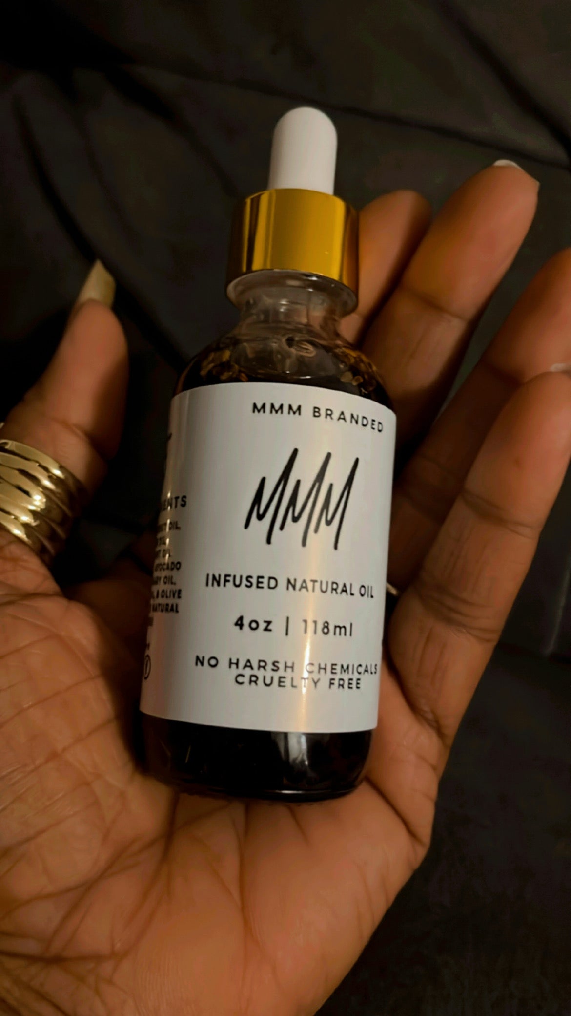 2 OZ BOTTLE OF INFUSED OIL AND 1 SCALP MASSAGER